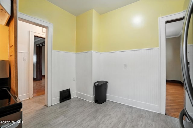 210 N Pierce St, Delphos, OH 45833 - interior space featuring wood finished floors and wainscoting