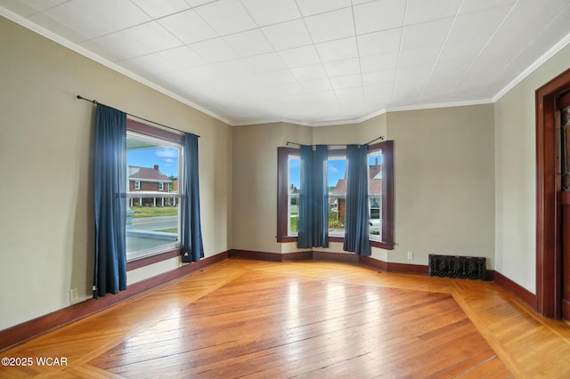 210 N Pierce St, Delphos, OH 45833 - empty room featuring healthy amount of natural light, wood-type flooring, and crown molding