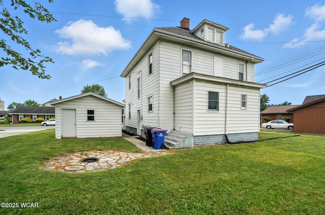 210 N Pierce St, Delphos, OH 45833 - back of property with a lawn and a chimney