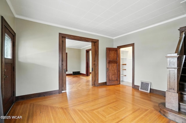 210 N Pierce St, Delphos, OH 45833 - unfurnished living room featuring crown molding and stairway