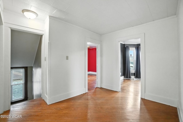 210 N Pierce St, Delphos, OH 45833 - spare room with healthy amount of natural light, wood finished floors, and crown molding