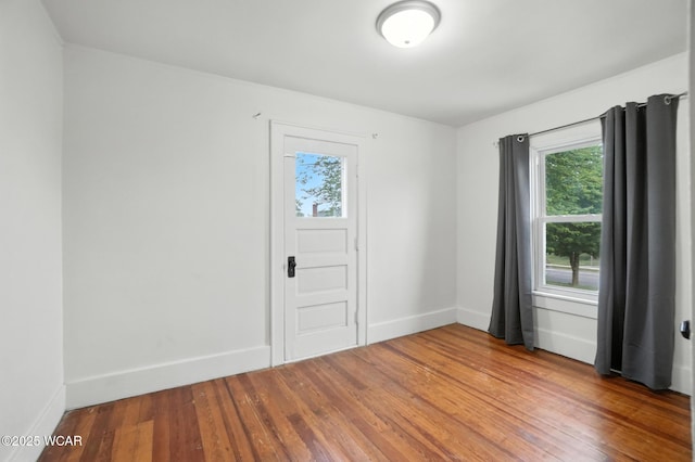 210 N Pierce St, Delphos, OH 45833 - empty room featuring wood finished floors and baseboards