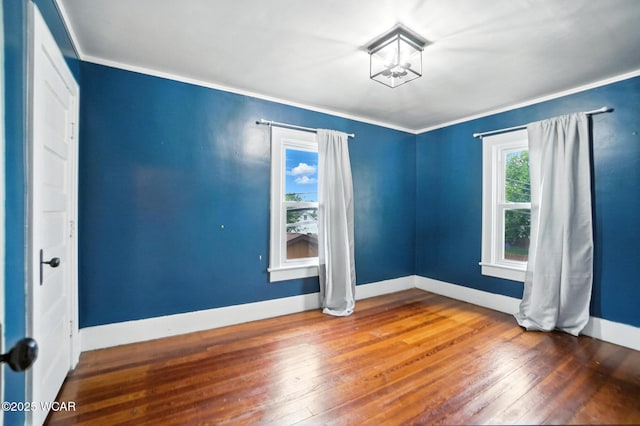 210 N Pierce St, Delphos, OH 45833 - empty room featuring hardwood / wood-style floors and crown molding