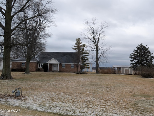 exterior space with an outbuilding, a shed, and fence