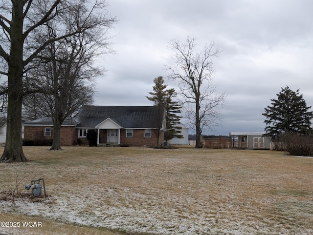 exterior space with an outdoor structure, fence, and a storage unit