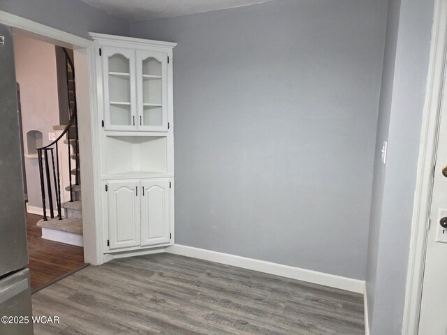 220 W N St, Elida, OH 45807 - spare room with wood finished floors and stairs