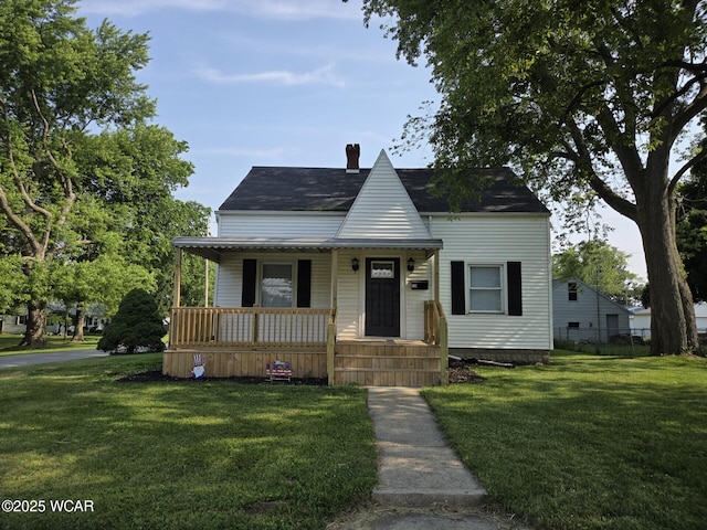 220 W N St, Elida, OH 45807 - view of front facade featuring a porch, a front lawn, and a chimney
