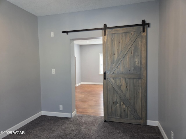 220 W N St, Elida, OH 45807 - carpeted empty room featuring a barn door