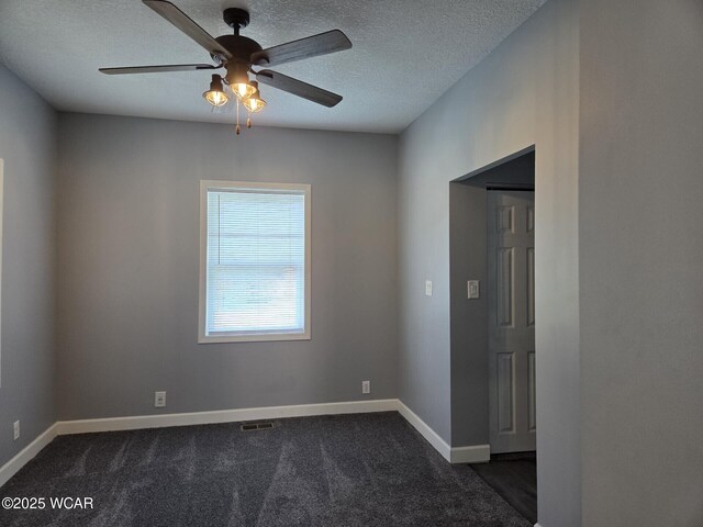 220 W N St, Elida, OH 45807 - unfurnished room with a ceiling fan, dark colored carpet, and a textured ceiling