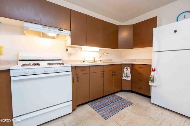 kitchen featuring sink and white appliances