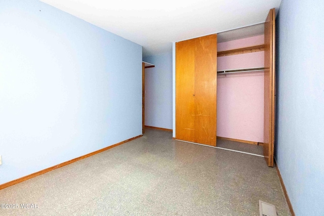 unfurnished bedroom with a closet