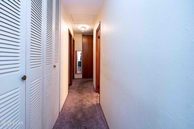 hall featuring dark colored carpet