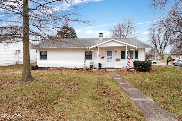 view of front facade with a front lawn and a porch