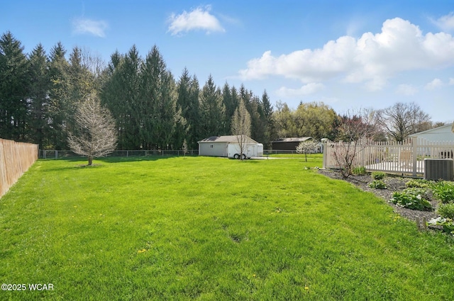 1543 Wonderlick Rd, Lima, OH 45805 - view of yard featuring central air condition unit and a fenced backyard