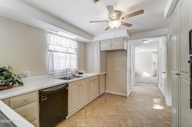 kitchen featuring a ceiling fan, a sink, black dishwasher, light countertops, and baseboards