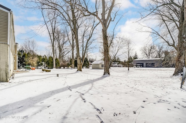 view of yard layered in snow