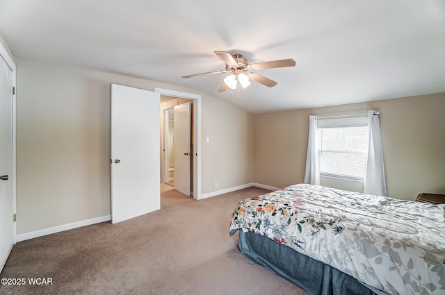 carpeted bedroom with baseboards and a ceiling fan