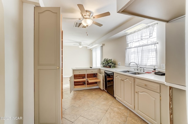 kitchen featuring a sink, dishwasher, light tile patterned floors, ceiling fan, and light countertops