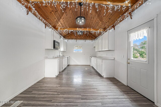 11820 County Road 17, West Unity, OH 43570 - kitchen featuring black microwave, wooden ceiling, dark wood-style floors, and light countertops