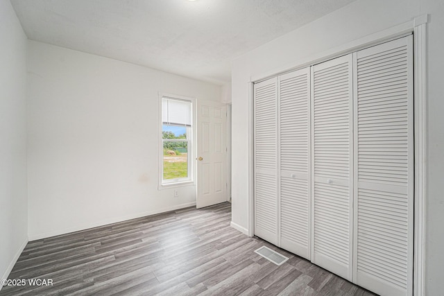 11820 County Road 17, West Unity, OH 43570 - unfurnished bedroom featuring wood finished floors and a closet