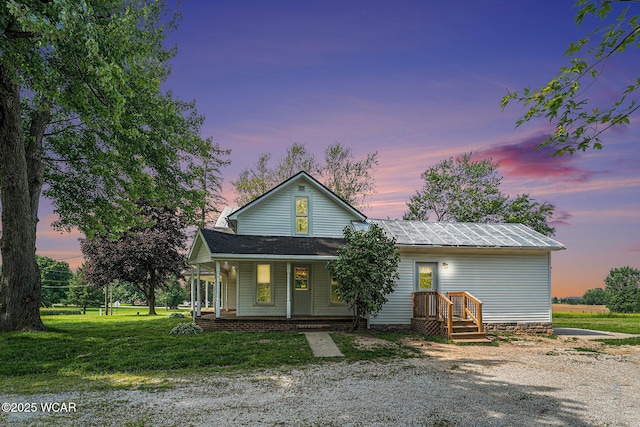 11820 County Road 17, West Unity, OH 43570 - view of front facade with a yard and covered porch