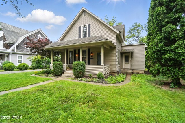 307 N Jefferson St, Van Wert, OH 45891 - view of front of home with covered porch and a front yard