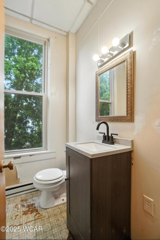 307 N Jefferson St, Van Wert, OH 45891 - bathroom with a baseboard heating unit and vanity