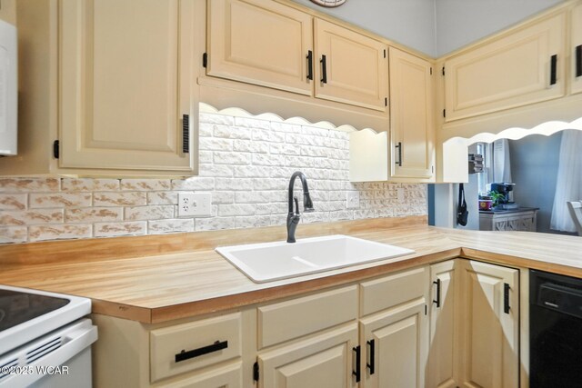 307 N Jefferson St, Van Wert, OH 45891 - kitchen with butcher block countertops, black dishwasher, and tasteful backsplash
