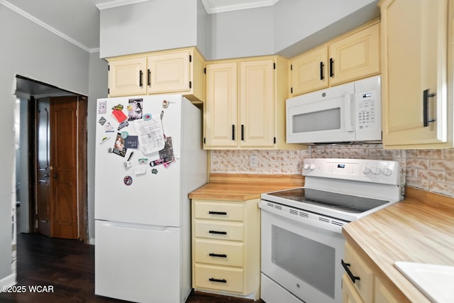 307 N Jefferson St, Van Wert, OH 45891 - kitchen featuring white appliances, crown molding, cream cabinetry, backsplash, and dark wood finished floors