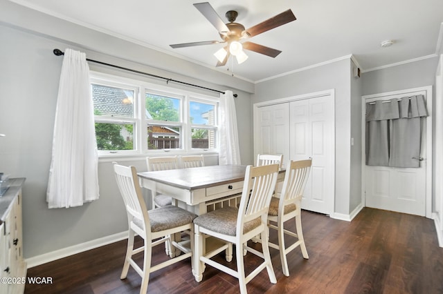 307 N Jefferson St, Van Wert, OH 45891 - dining area featuring ornamental molding, dark wood-type flooring, and a ceiling fan