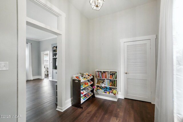 307 N Jefferson St, Van Wert, OH 45891 - recreation room with dark wood finished floors and ornamental molding