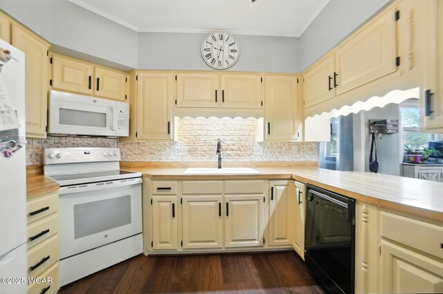 307 N Jefferson St, Van Wert, OH 45891 - kitchen featuring white appliances, decorative backsplash, dark wood-type flooring, and crown molding