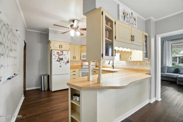 307 N Jefferson St, Van Wert, OH 45891 - kitchen with white appliances, a ceiling fan, decorative backsplash, dark wood-style floors, and ornamental molding