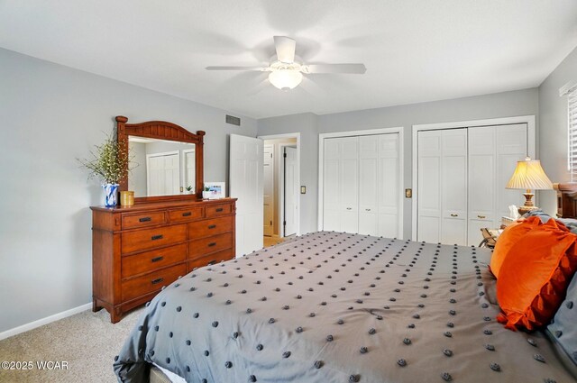2357 London Dr, Lima, OH 45805 - carpeted bedroom featuring two closets, baseboards, and ceiling fan