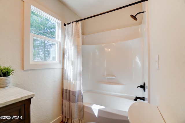bathroom featuring shower / bathtub combination with curtain and vanity