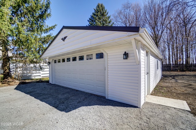 detached garage with fence