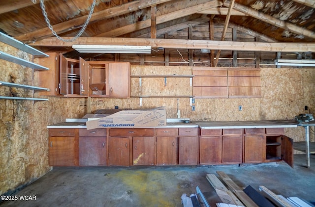 kitchen with vaulted ceiling and open shelves