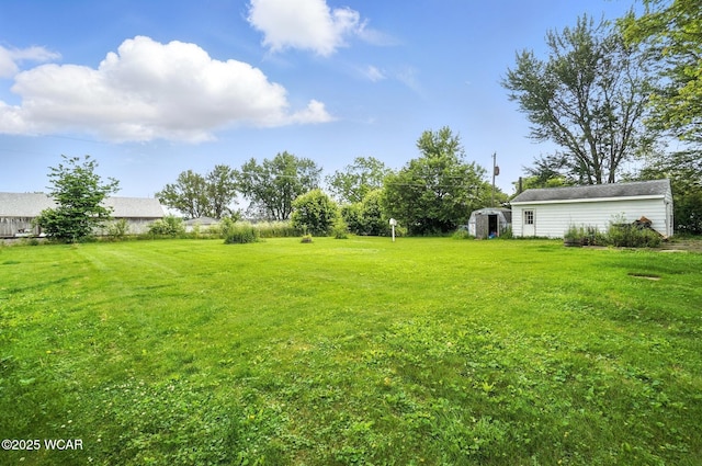 5176 Norfolk St, Lima, OH 45806 - view of green lawn featuring a storage unit
