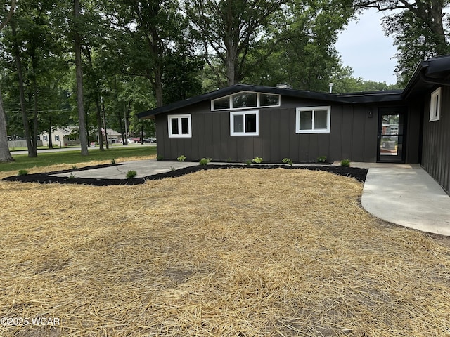 1271 Forest Dr, Lima, OH 45805 - view of side of home with board and batten siding
