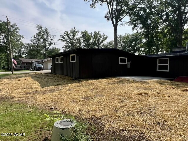 1271 Forest Dr, Lima, OH 45805 - view of side of home with board and batten siding