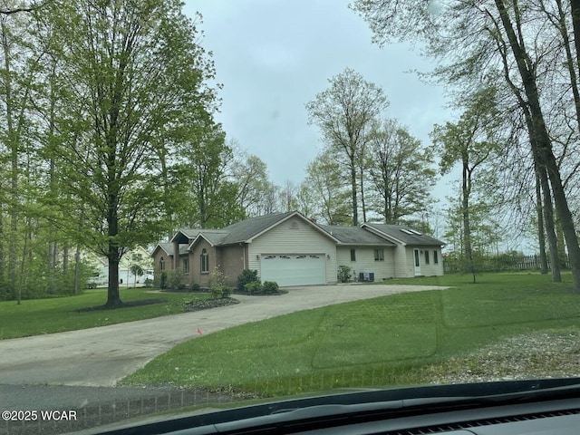 1421 Krendl Dr, Van Wert, OH 45891 - single story home featuring driveway, a front yard, and an attached garage