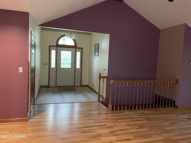 1421 Krendl Dr, Van Wert, OH 45891 - foyer entrance with light wood finished floors, vaulted ceiling, and baseboards