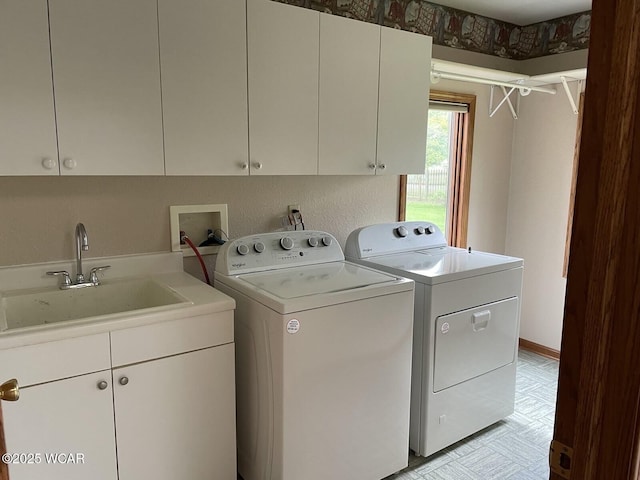 1421 Krendl Dr, Van Wert, OH 45891 - clothes washing area with washer and clothes dryer, cabinet space, and light flooring