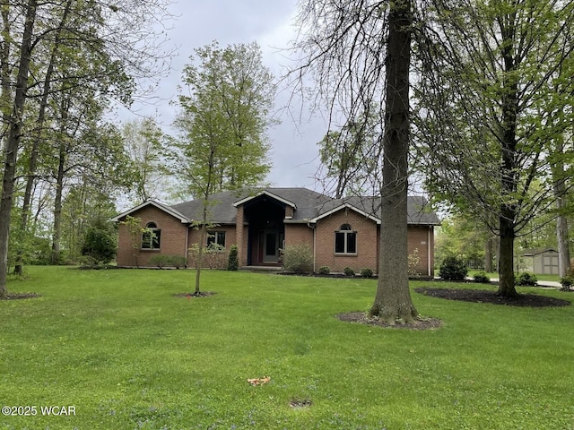 1421 Krendl Dr, Van Wert, OH 45891 - ranch-style home featuring a front lawn and brick siding