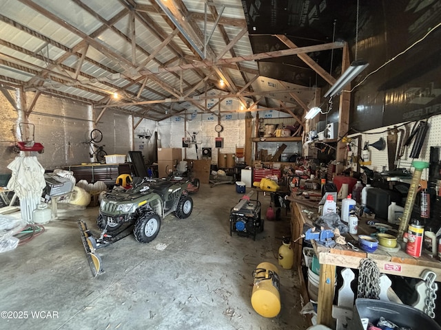 garage with a workshop area and metal wall