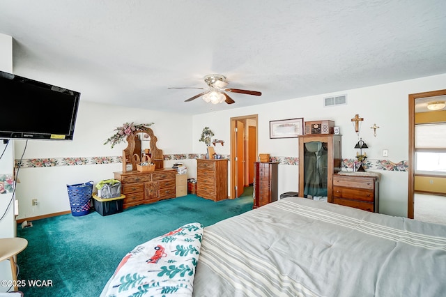carpeted bedroom with a ceiling fan, a textured ceiling, baseboards, and visible vents