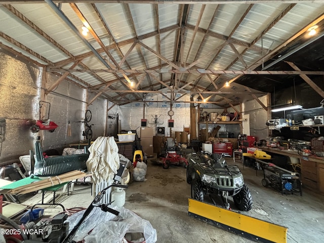 garage with a workshop area and metal wall