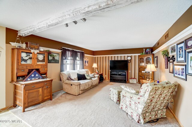 carpeted living room with baseboards and visible vents