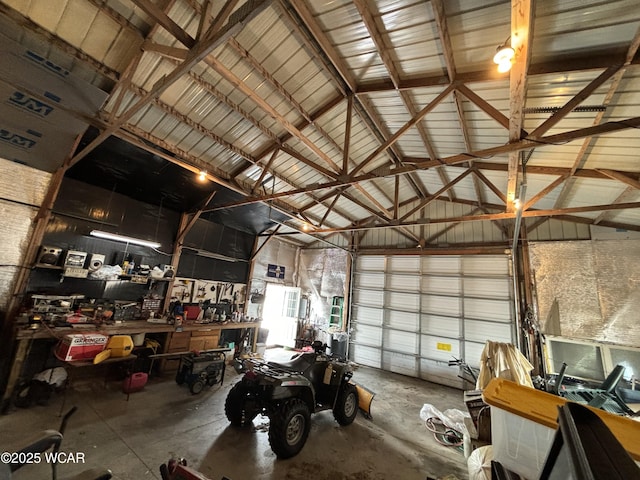 garage with metal wall and a workshop area