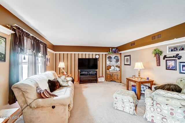 living room with carpet and visible vents
